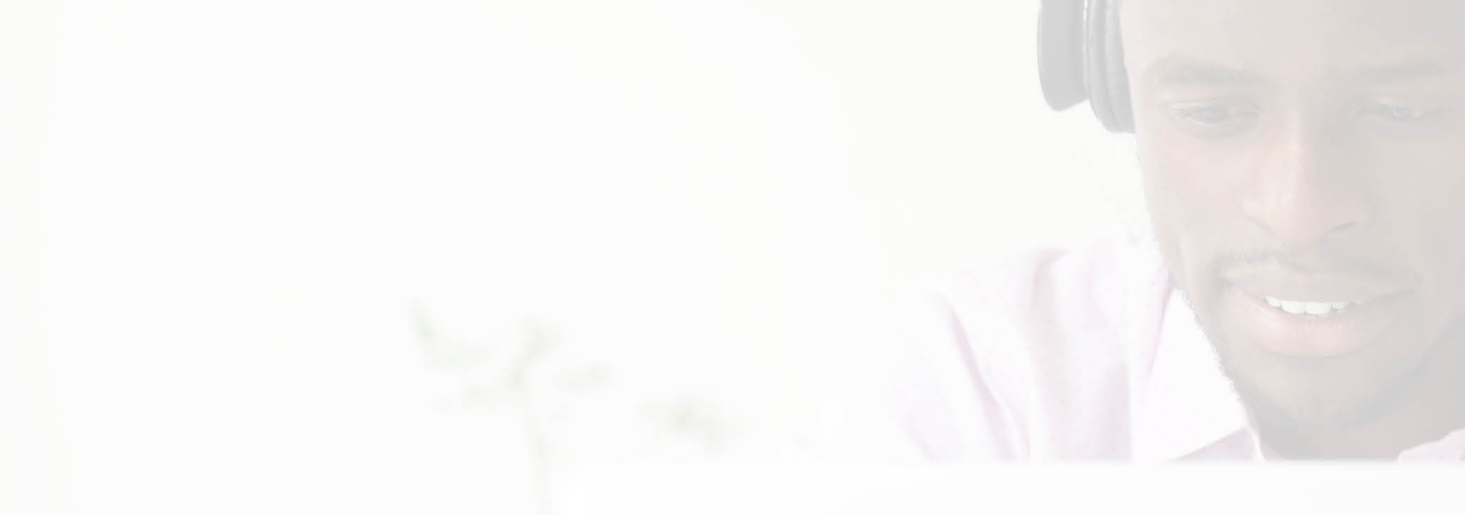 Smiling African American student wearing headphones looking at laptop screen, watching webinar taking online study course, browsing web, searching for information, e-learning person headshot portrait