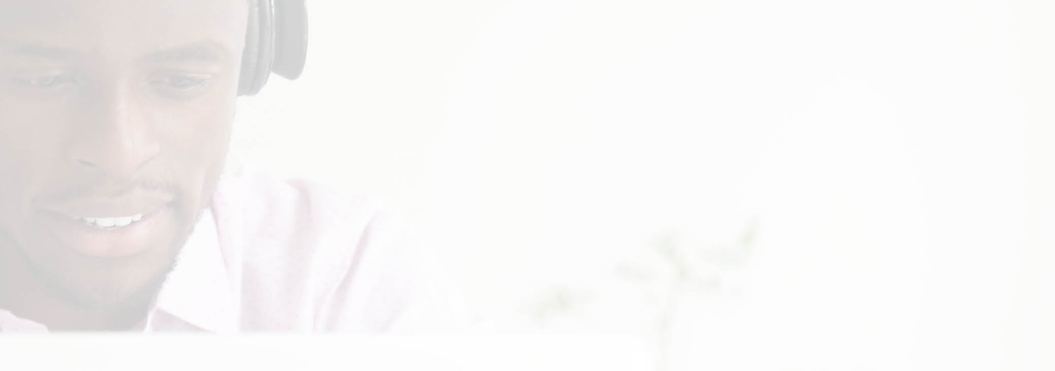 Smiling African American student wearing headphones looking at laptop screen, watching webinar taking online study course, browsing web, searching for information, e-learning person headshot portrait