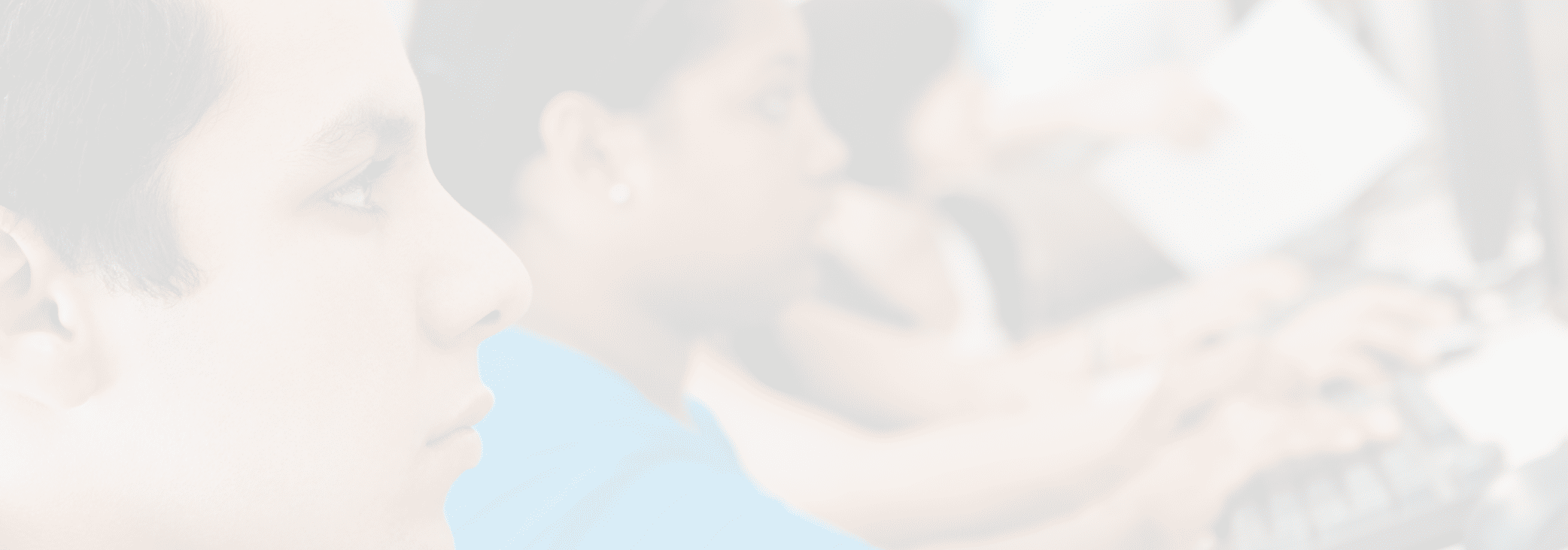 Multiethnic students using computer with professor in lab