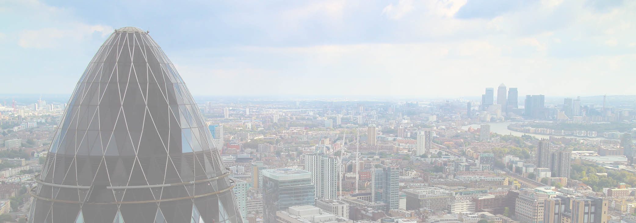 London panoramic view over Gherkin, Canary Wharf and the Thames river, taken on a cloudy, summer day