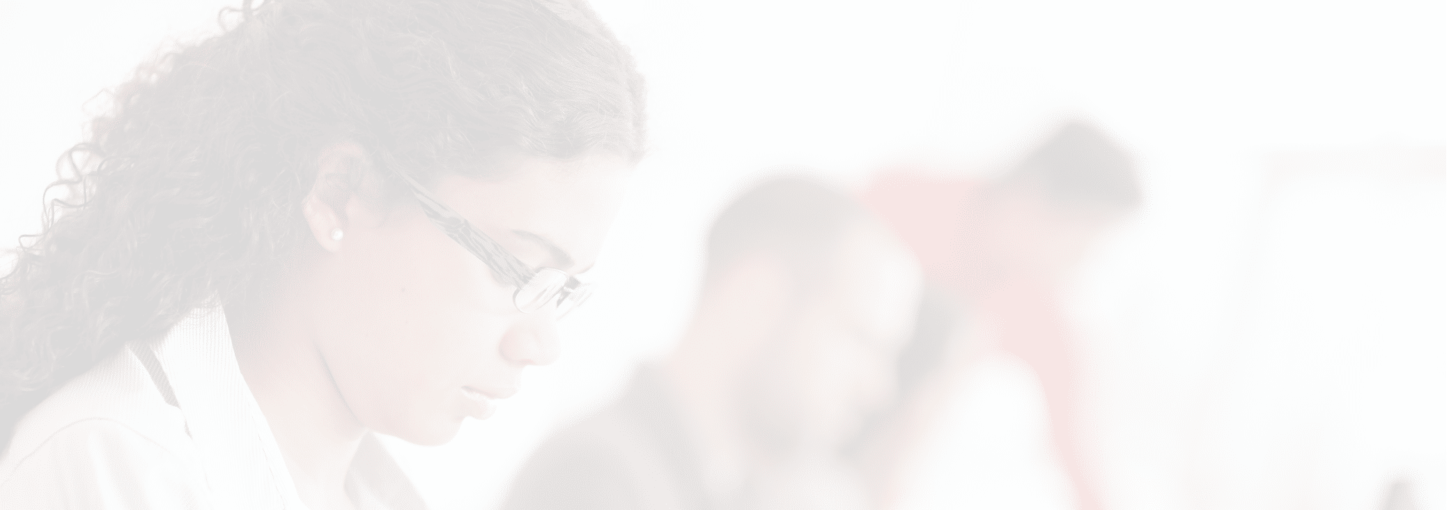 Portrait of smiling student in front of laptop computer