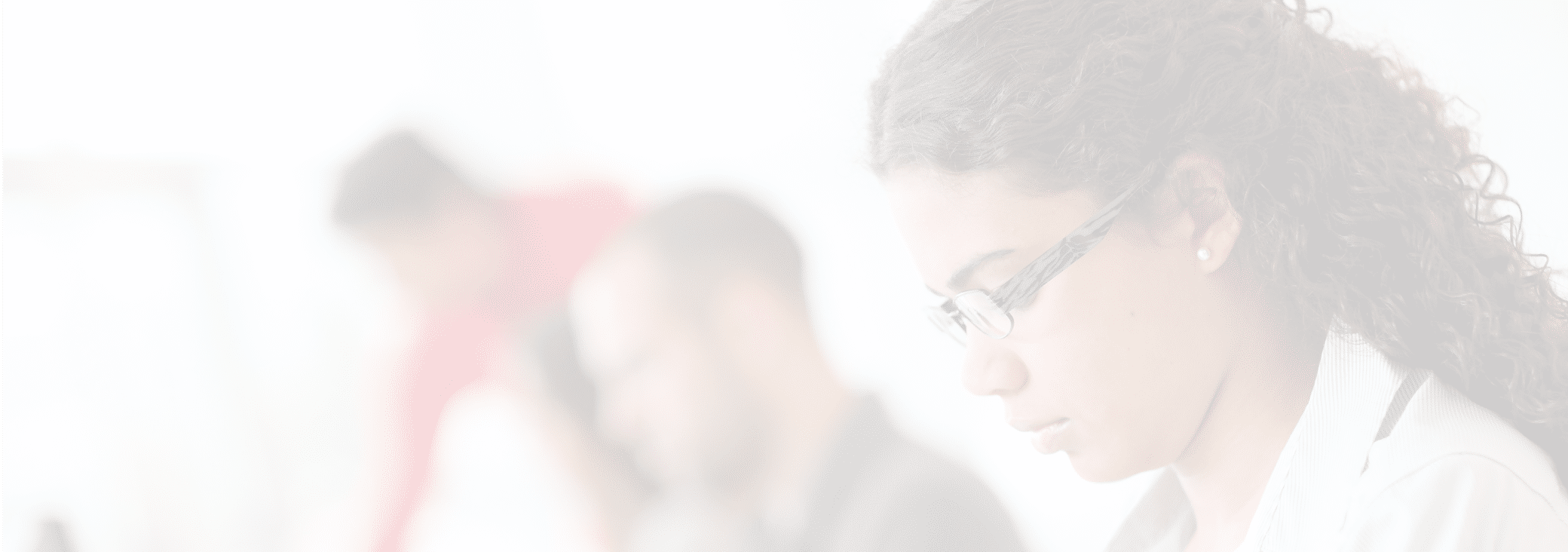 Portrait of smiling student in front of laptop computer