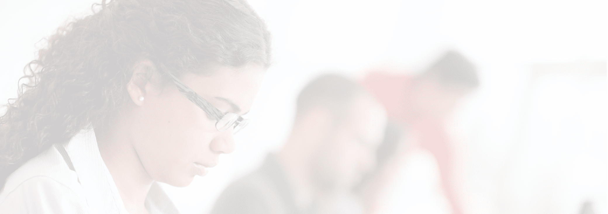 Portrait of smiling student in front of laptop computer