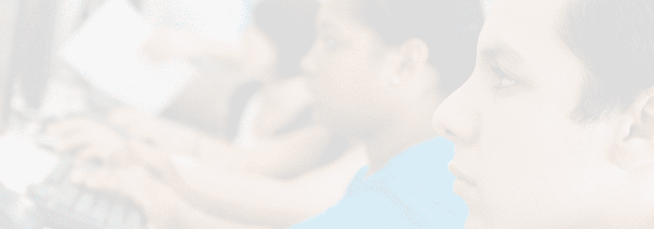 Multiethnic students using computer with professor in lab